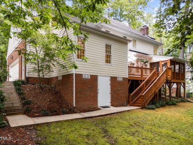 Nestled on a desirable corner lot, surrounded by mature trees in on Devils Ridge Golf Club in North Carolina - for sale on GolfHomes.com, golf home, golf lot