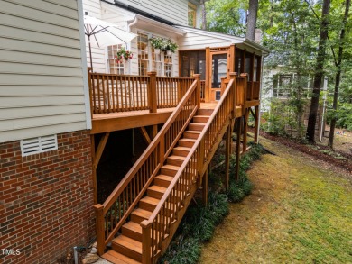 Nestled on a desirable corner lot, surrounded by mature trees in on Devils Ridge Golf Club in North Carolina - for sale on GolfHomes.com, golf home, golf lot
