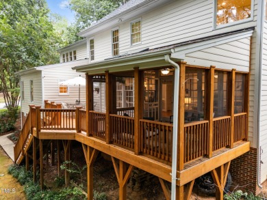 Nestled on a desirable corner lot, surrounded by mature trees in on Devils Ridge Golf Club in North Carolina - for sale on GolfHomes.com, golf home, golf lot