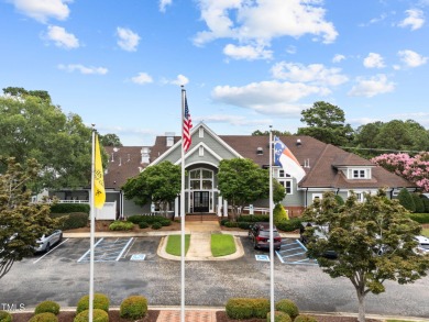 Nestled on a desirable corner lot, surrounded by mature trees in on Devils Ridge Golf Club in North Carolina - for sale on GolfHomes.com, golf home, golf lot