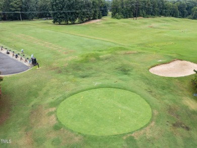 Nestled on a desirable corner lot, surrounded by mature trees in on Devils Ridge Golf Club in North Carolina - for sale on GolfHomes.com, golf home, golf lot