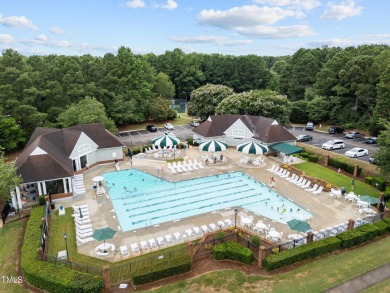 Nestled on a desirable corner lot, surrounded by mature trees in on Devils Ridge Golf Club in North Carolina - for sale on GolfHomes.com, golf home, golf lot