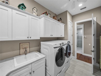 Under contract-accepting backup offers. Luxury living at its on Lake Jovita Golf and Country Club in Florida - for sale on GolfHomes.com, golf home, golf lot