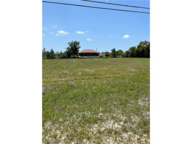 Build your dream home on this spacious double wide canal lot on Coral Oaks Golf Course in Florida - for sale on GolfHomes.com, golf home, golf lot