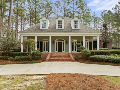 A wood-beamed pavilion, a fire pit glowing under string lights on Canebrake Country Club in Mississippi - for sale on GolfHomes.com, golf home, golf lot