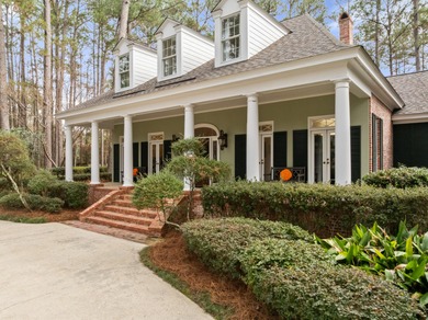 A wood-beamed pavilion, a fire pit glowing under string lights on Canebrake Country Club in Mississippi - for sale on GolfHomes.com, golf home, golf lot