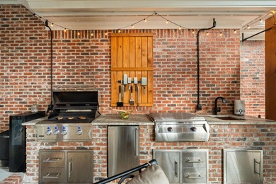 A wood-beamed pavilion, a fire pit glowing under string lights on Canebrake Country Club in Mississippi - for sale on GolfHomes.com, golf home, golf lot