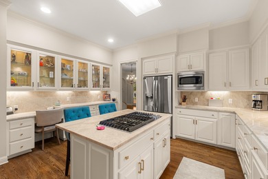 A wood-beamed pavilion, a fire pit glowing under string lights on Canebrake Country Club in Mississippi - for sale on GolfHomes.com, golf home, golf lot