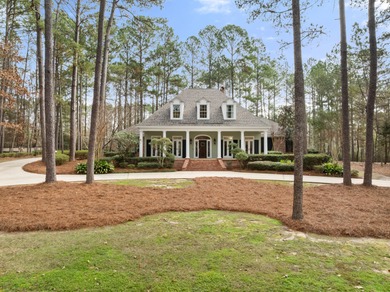 A wood-beamed pavilion, a fire pit glowing under string lights on Canebrake Country Club in Mississippi - for sale on GolfHomes.com, golf home, golf lot