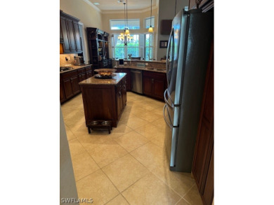 Step into the covered entry and elegant foyer, a formal dining on Estero Country Club in Florida - for sale on GolfHomes.com, golf home, golf lot