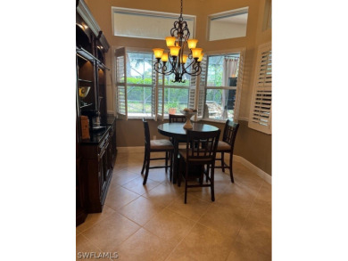 Step into the covered entry and elegant foyer, a formal dining on Estero Country Club in Florida - for sale on GolfHomes.com, golf home, golf lot