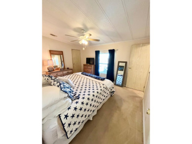 Looking for a cozy winter getaway or a year-round haven? This on Pine Lakes Country Club in Florida - for sale on GolfHomes.com, golf home, golf lot