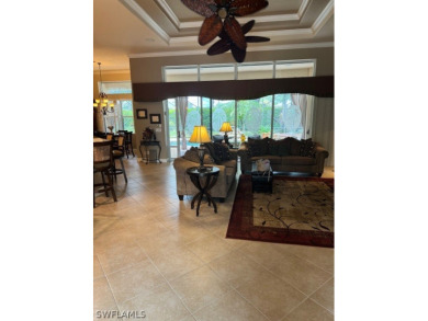 Step into the covered entry and elegant foyer, a formal dining on Estero Country Club in Florida - for sale on GolfHomes.com, golf home, golf lot