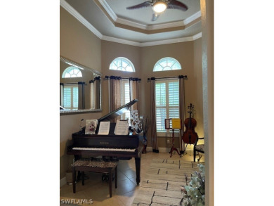 Step into the covered entry and elegant foyer, a formal dining on Estero Country Club in Florida - for sale on GolfHomes.com, golf home, golf lot