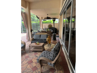 Step into the covered entry and elegant foyer, a formal dining on Estero Country Club in Florida - for sale on GolfHomes.com, golf home, golf lot