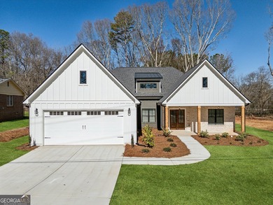 Nestled in the prestigious gated community of The Orchard in on The Orchard Golf and Country Club in Georgia - for sale on GolfHomes.com, golf home, golf lot