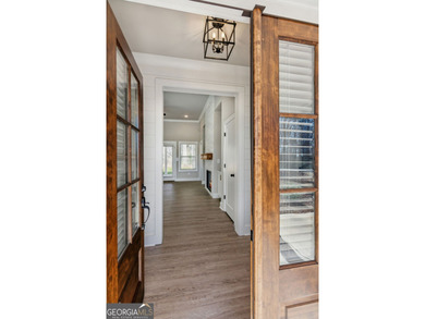 Nestled in the prestigious gated community of The Orchard in on The Orchard Golf and Country Club in Georgia - for sale on GolfHomes.com, golf home, golf lot