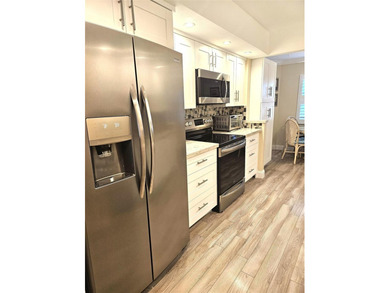 Welcome to luxury 55+ living at Wynmoor Country Club! This on Wynmoor Golf Course in Florida - for sale on GolfHomes.com, golf home, golf lot