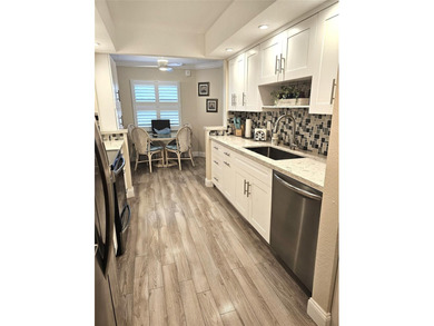 Welcome to luxury 55+ living at Wynmoor Country Club! This on Wynmoor Golf Course in Florida - for sale on GolfHomes.com, golf home, golf lot