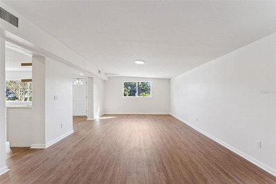One or more photo(s) has been virtually stagedpletely remodeled on Country Club of Orlando in Florida - for sale on GolfHomes.com, golf home, golf lot