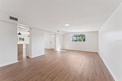 One or more photo(s) has been virtually stagedpletely remodeled on Country Club of Orlando in Florida - for sale on GolfHomes.com, golf home, golf lot