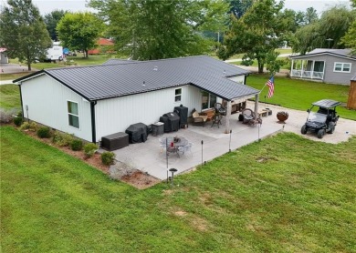 3 LOTS!!! The 3br 2 Ba updated in Rustic decor home is located on Linn Valley Lakes - Deer Trace Golf Course in Kansas - for sale on GolfHomes.com, golf home, golf lot