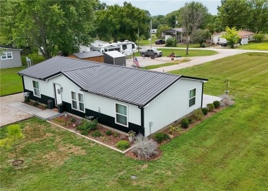 3 LOTS!!! The 3br 2 Ba updated in Rustic decor home is located on Linn Valley Lakes - Deer Trace Golf Course in Kansas - for sale on GolfHomes.com, golf home, golf lot