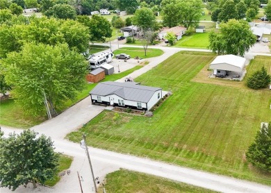 3 LOTS!!! The 3br 2 Ba updated in Rustic decor home is located on Linn Valley Lakes - Deer Trace Golf Course in Kansas - for sale on GolfHomes.com, golf home, golf lot