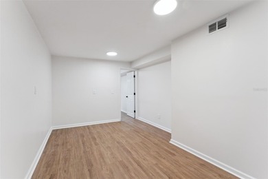 One or more photo(s) has been virtually stagedpletely remodeled on Country Club of Orlando in Florida - for sale on GolfHomes.com, golf home, golf lot