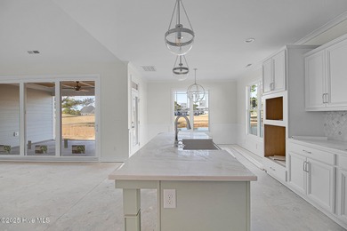 Situated on the golf course in Beaufort Club, 111 Windswept Lane on North River Club in North Carolina - for sale on GolfHomes.com, golf home, golf lot