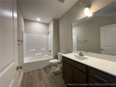 This beautiful three bedroom, two bathroom luxury condo in on Anderson Creek Golf Club in North Carolina - for sale on GolfHomes.com, golf home, golf lot