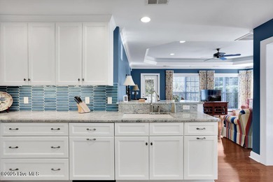 Serene nature views await you in this stunning brick home on Cape Fear National At Brunswick Forest in North Carolina - for sale on GolfHomes.com, golf home, golf lot