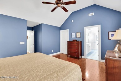 Serene nature views await you in this stunning brick home on Cape Fear National At Brunswick Forest in North Carolina - for sale on GolfHomes.com, golf home, golf lot