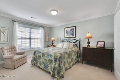 Serene nature views await you in this stunning brick home on Cape Fear National At Brunswick Forest in North Carolina - for sale on GolfHomes.com, golf home, golf lot