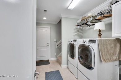 Serene nature views await you in this stunning brick home on Cape Fear National At Brunswick Forest in North Carolina - for sale on GolfHomes.com, golf home, golf lot