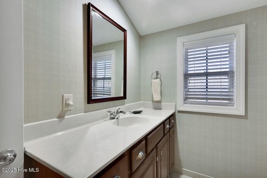 Serene nature views await you in this stunning brick home on Cape Fear National At Brunswick Forest in North Carolina - for sale on GolfHomes.com, golf home, golf lot