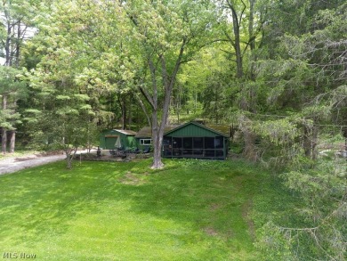 This charming, intimate  updated 3-bedroom lake view cottage is on Atwood Lake Resort Golf Course in Ohio - for sale on GolfHomes.com, golf home, golf lot