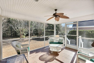 Serene nature views await you in this stunning brick home on Cape Fear National At Brunswick Forest in North Carolina - for sale on GolfHomes.com, golf home, golf lot