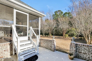 Serene nature views await you in this stunning brick home on Cape Fear National At Brunswick Forest in North Carolina - for sale on GolfHomes.com, golf home, golf lot