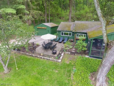 This charming, intimate  updated 3-bedroom lake view cottage is on Atwood Lake Resort Golf Course in Ohio - for sale on GolfHomes.com, golf home, golf lot