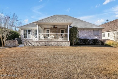 Serene nature views await you in this stunning brick home on Cape Fear National At Brunswick Forest in North Carolina - for sale on GolfHomes.com, golf home, golf lot