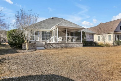 Serene nature views await you in this stunning brick home on Cape Fear National At Brunswick Forest in North Carolina - for sale on GolfHomes.com, golf home, golf lot