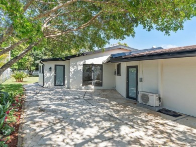 4-bedroom, 3-bathroom single-family oasis in the coveted Country on Fort Lauderdale Country Club in Florida - for sale on GolfHomes.com, golf home, golf lot