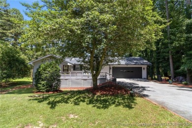 Incredible waterfront home located within the gated community of on Carolina Trace Country Club in North Carolina - for sale on GolfHomes.com, golf home, golf lot