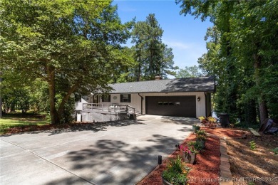 Incredible waterfront home located within the gated community of on Carolina Trace Country Club in North Carolina - for sale on GolfHomes.com, golf home, golf lot