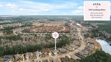 Serene nature views await you in this stunning brick home on Cape Fear National At Brunswick Forest in North Carolina - for sale on GolfHomes.com, golf home, golf lot