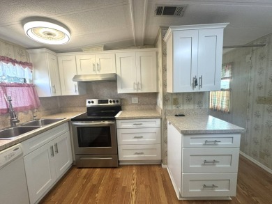 Nicely updated home with newer kitchen appliances, washer/dryer on Golden Lakes Golf Course in Florida - for sale on GolfHomes.com, golf home, golf lot