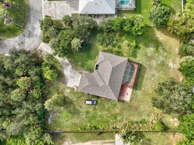 Charming pool home in Papaya Village on a rare 3/4 acre homesite on Eagle Wood Golf Course in Florida - for sale on GolfHomes.com, golf home, golf lot