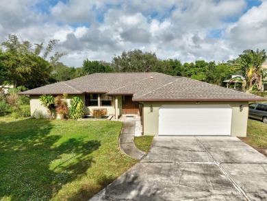 Charming pool home in Papaya Village on a rare 3/4 acre homesite on Eagle Wood Golf Course in Florida - for sale on GolfHomes.com, golf home, golf lot