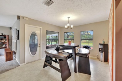 Charming pool home in Papaya Village on a rare 3/4 acre homesite on Eagle Wood Golf Course in Florida - for sale on GolfHomes.com, golf home, golf lot